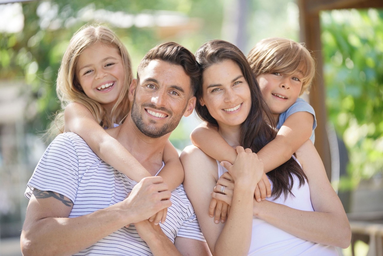 Smiling family showing healthy teeth from daily dental habits in Mansfield, TX