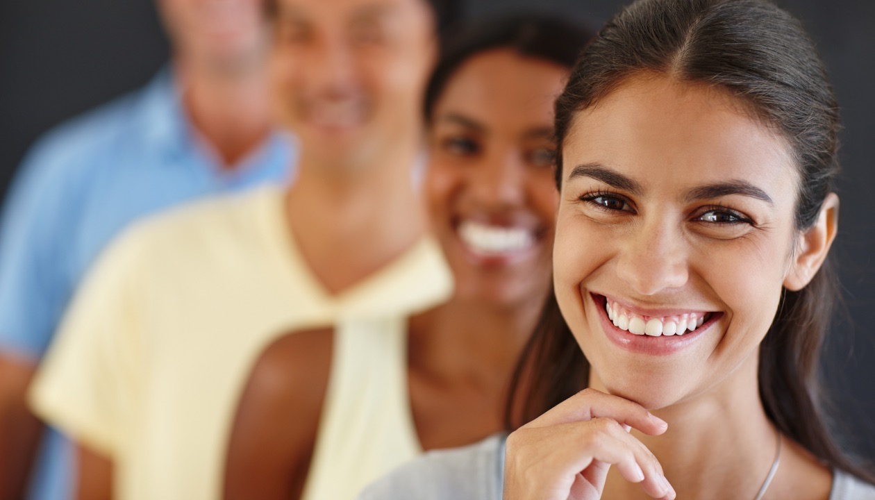 Woman with confident smile after lingual braces treatment by orthodontist in Mansfield, TX